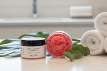 Load image into Gallery viewer, Wildflower Soapary Mango + Coconut Sugar Scrub on a white surface with a gray background