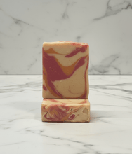 Load image into Gallery viewer, Two marbled soap bars stacked on a marble surface