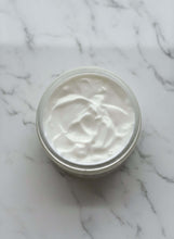 Load image into Gallery viewer, Spiced Vanilla body butter in a clear jar on a marble surface, showcasing its creamy texture.