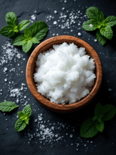 Load image into Gallery viewer, Natural tallow sugar scrub with peppermint leaves in a wooden bowl on a dark surface.