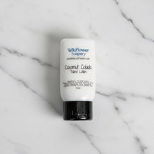 Load image into Gallery viewer, Coconut Colada Tallow Lotion bottle on marble surface, rich hemp lotion for tropical skincare.