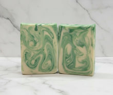 Load image into Gallery viewer, Goat Milk Soap - Eucalyptus bars with green swirls on a marble background, showcasing creamy lather and moisturizing benefits.