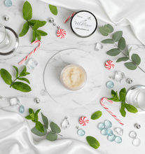 Load image into Gallery viewer, Peppermint Tallow Sugar Scrub with candy canes and fresh mint on a marble surface.