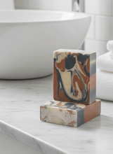 Load image into Gallery viewer, Bergamot & Sandalwood goat milk soap bars on a marble countertop with a modern sink in the background.