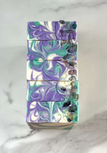 Load image into Gallery viewer, Spa Day Goat Milk Soap bars with vibrant purple and green swirls, enriched for a luxurious skincare experience.