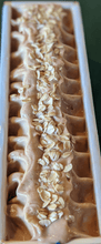 Load image into Gallery viewer, Loaf of soap with oatmeal on top.