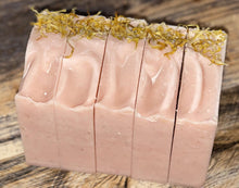 Load image into Gallery viewer, Light pink soap with yellow flower pedals on top