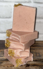 Load image into Gallery viewer, Light pink soap with yellow flower pedals on top stacked
