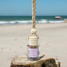 Load image into Gallery viewer, Sandy Beach hanging car diffuser with creamy coconut and sandalwood scent by the shore.

