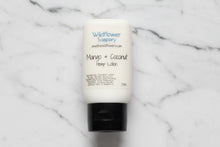 Load image into Gallery viewer, Tube of Wildflower Soapery Mango &amp; Coconut Hemp Lotion on a textured white background
