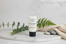 Load image into Gallery viewer, Herbal Indulgence Tallow Lotion displayed on marble with greenery and stones, showcasing its nourishing qualities.
