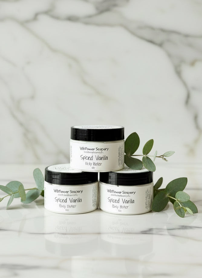 Two small cylindrical containers on a textured surface with a blurred background