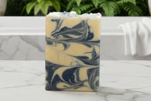 Load image into Gallery viewer, Sandalwood Goat Milk Soap with swirled blue and cream colors, ideal for nourishing skin through luxurious cleansing.

