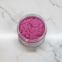 Load image into Gallery viewer, Coconut Colada Tallow Sugar Scrub in a clear jar showcasing the vibrant pink exfoliating scrub texture.
