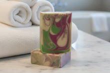 Load image into Gallery viewer, Agave Lime Goat Milk Soap bars with creamy lather against soft towels, showcasing vibrant colors and luxurious texture.
