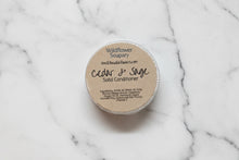 Load image into Gallery viewer, Cedar &amp; Sage Solid Conditioner Bar in packaging on a marble surface, ideal for enhanced hair care.
